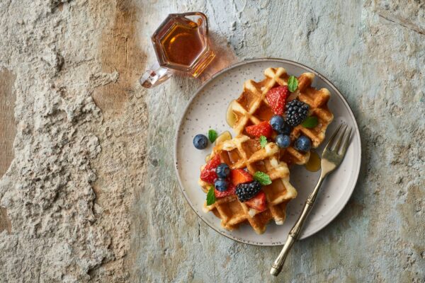 Brioche Waffle With Syrup and Fruits