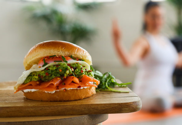 A photo of a Salmon and Cream Cheese Brioche Roll recipe on a wooden board
